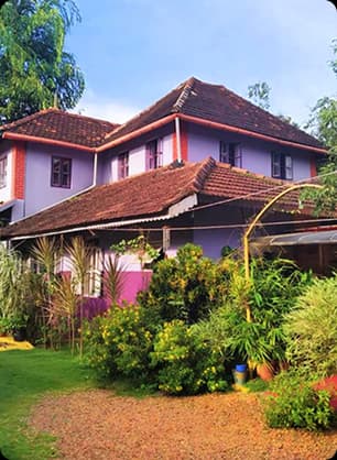 Peaceful homestay with tiled roof and garden space reflecting local culture and warm hospitality