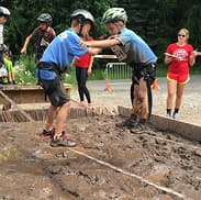 Kids participate in fun outdoor team games designed to be safe and age appropriate for students.