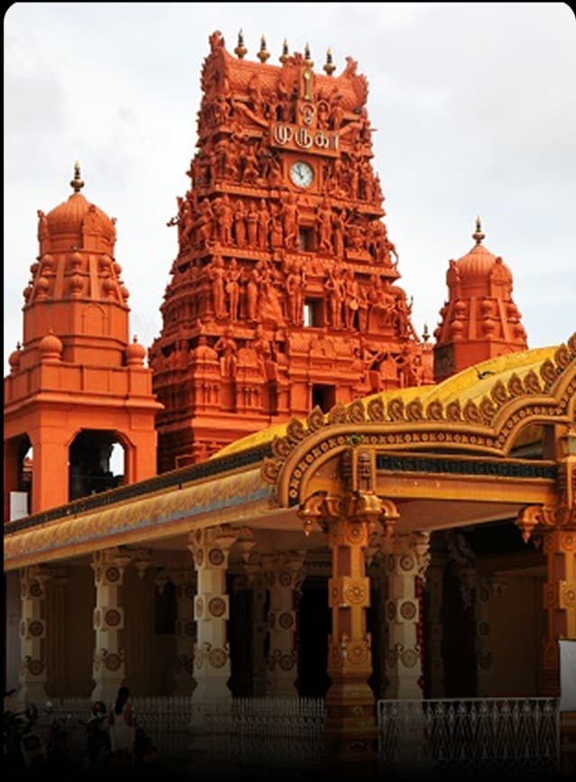 Temple in Karur featuring colorful carvings, detailed artwork, and traditional South Indian architecture.