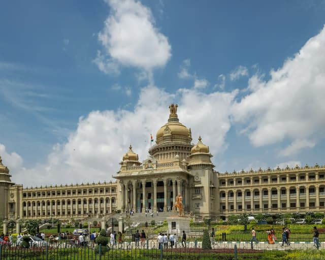Vidhana Soudha in Bangalore featuring massive pillars, domes, and the iconic government building design.